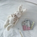 thermometer and pills on bed