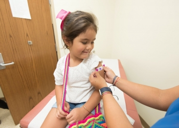 girl getting vaccinated