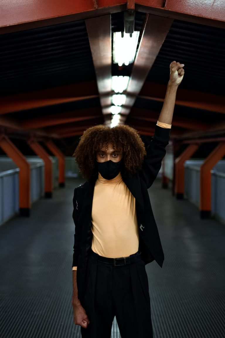 photo of man putting his hands up