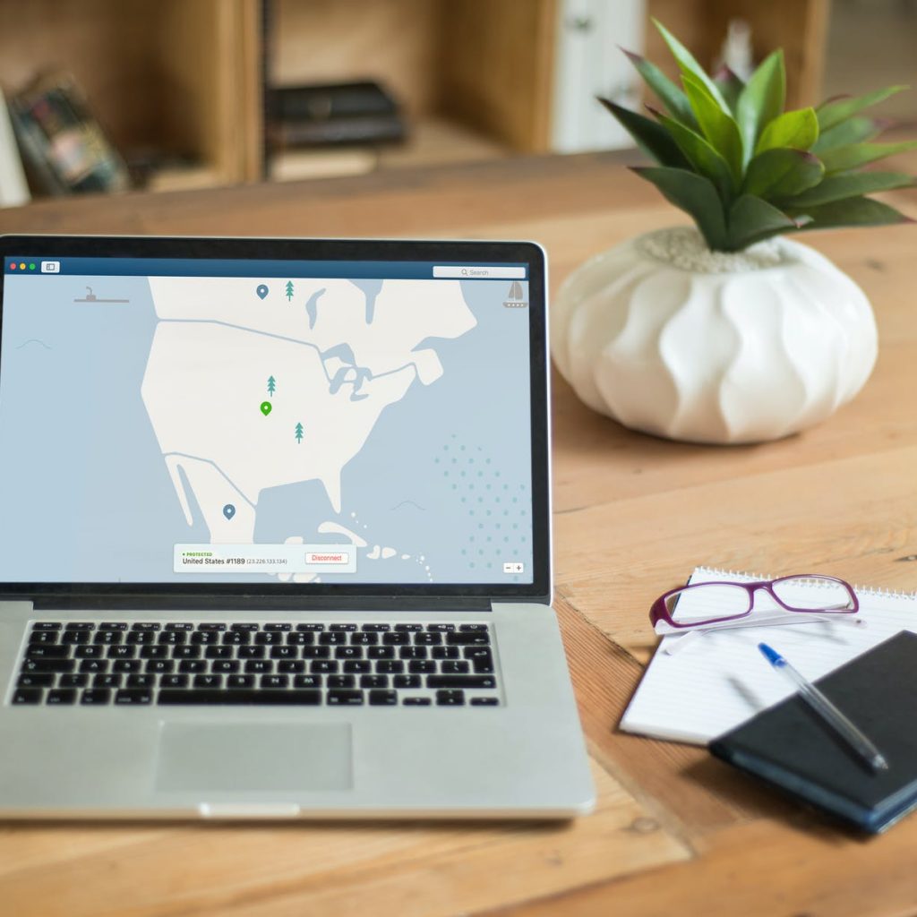 macbook pro on brown wooden table