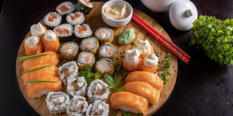 japanese sushi and sashimi on wooden tray
