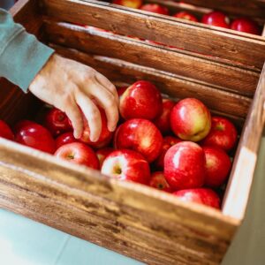 red apples on wooden crates