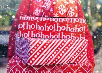 woman carrying christmas gifts