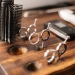 silver and black skeleton key on brown wooden table