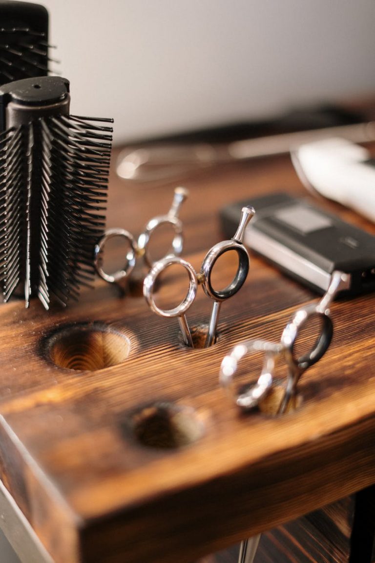 silver and black skeleton key on brown wooden table