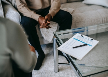 crop ethnic man in psychotherapy office