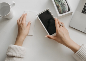 a person holding a phone in the box