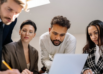 group of men and women working as a team