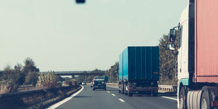 blue and red freight truck on road