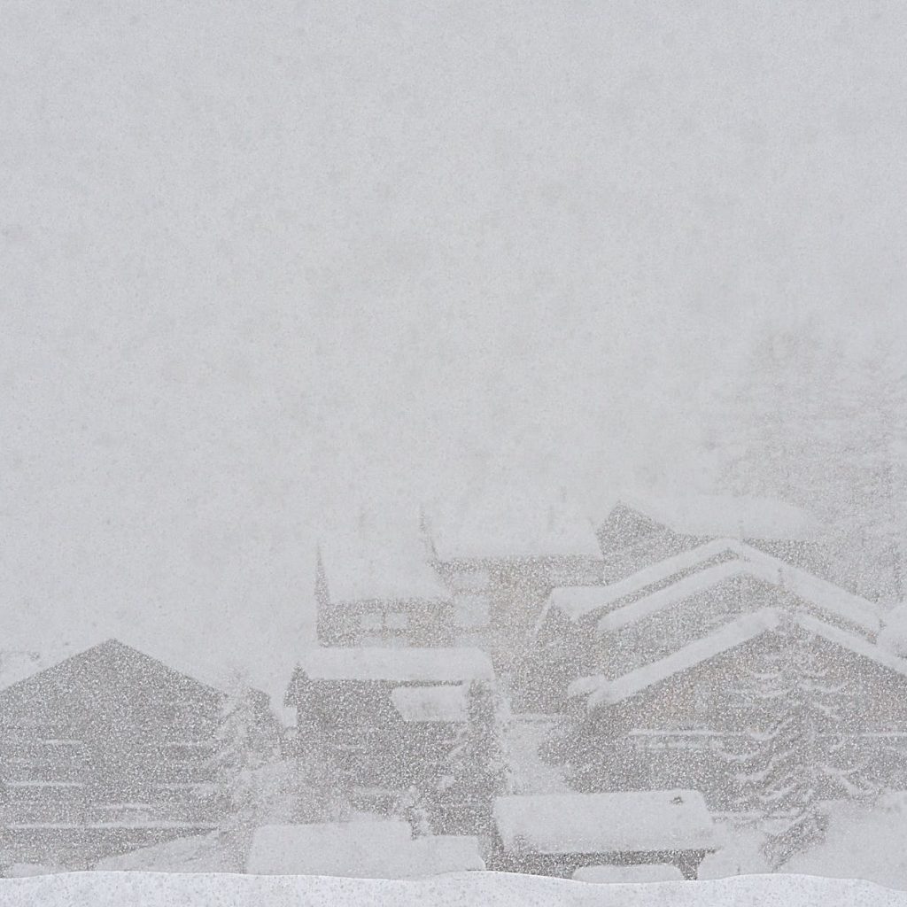 rural snowy village during severe blizzard