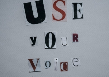 use your voice inscription on gray background