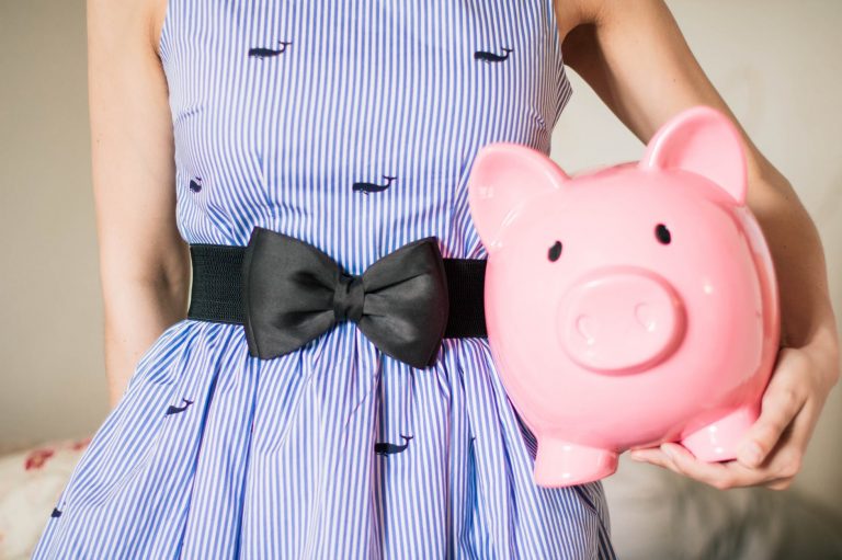 person holding a piggy bank