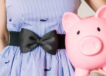 person holding a piggy bank