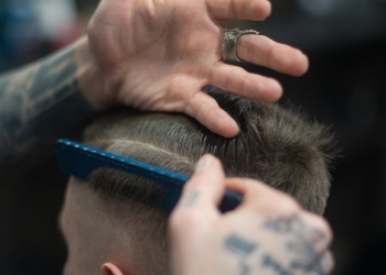 person combing person s hair