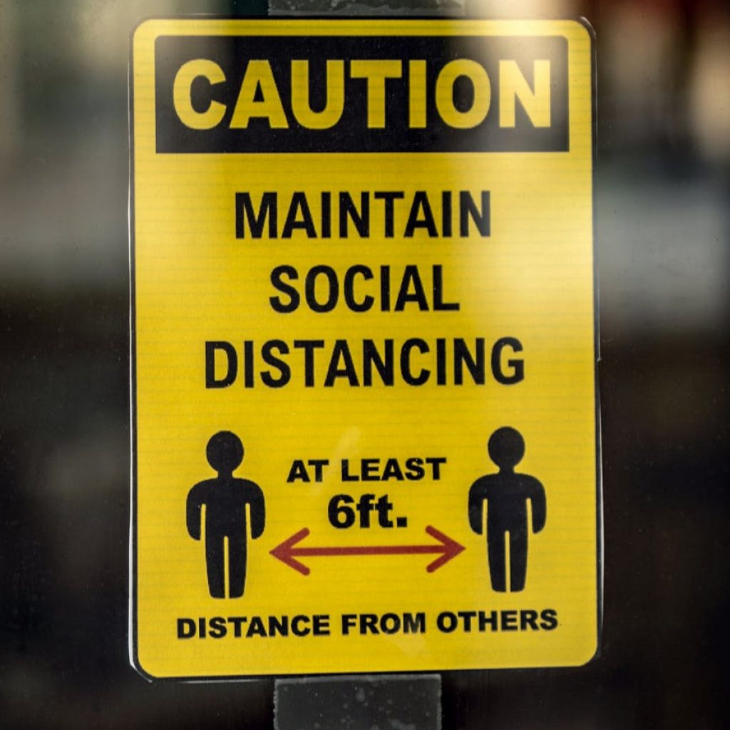 yellow and black caution wet floor sign