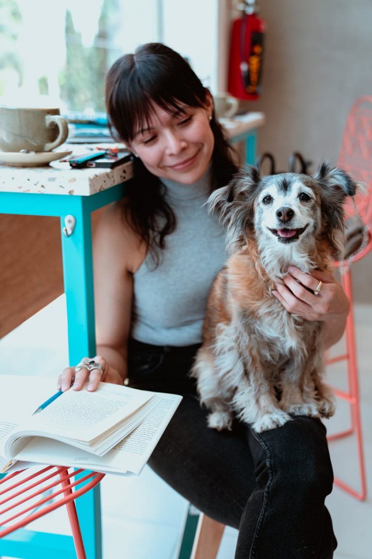 a woman holding her pet dog