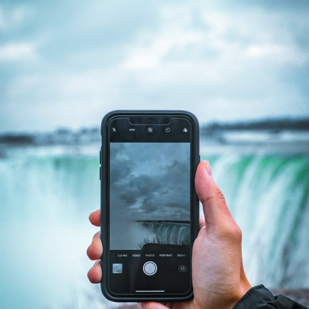 person holding black smartphone