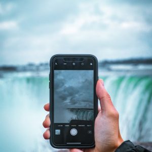 person holding black smartphone