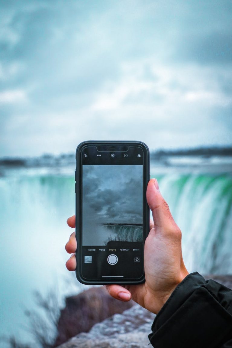 person holding black smartphone