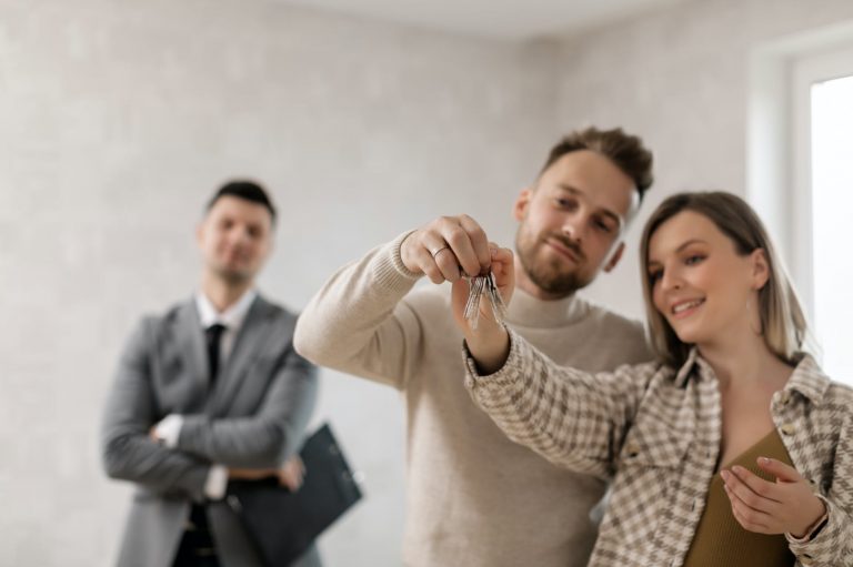 a couple holding their keys