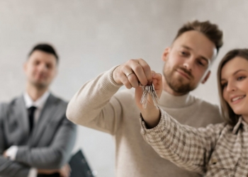 a couple holding their keys
