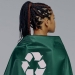 a back view of a woman in green cape