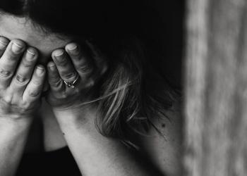 grayscale photography of crying woman