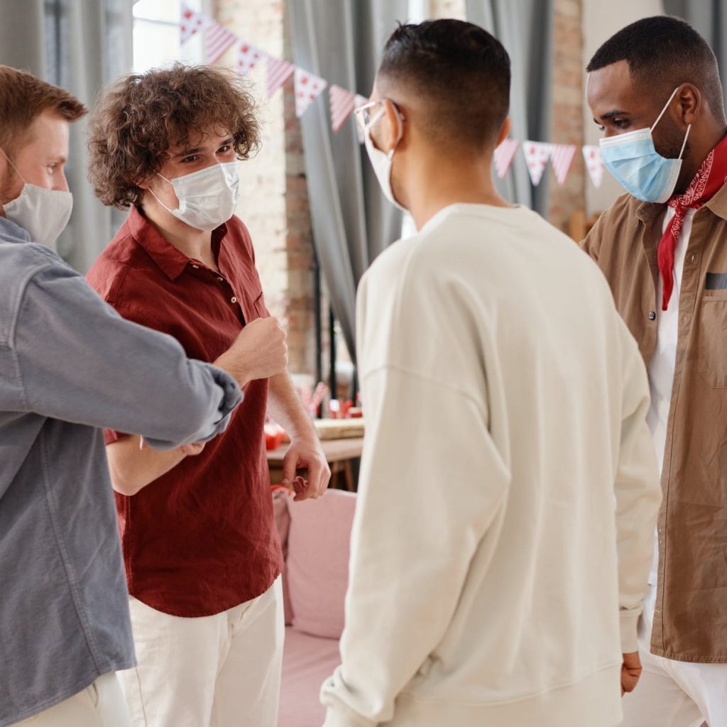 a group of friends wearing face masks
