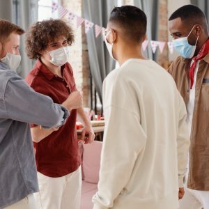 a group of friends wearing face masks