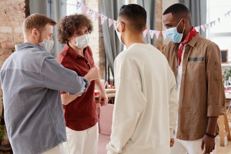 a group of friends wearing face masks
