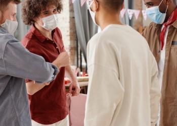 a group of friends wearing face masks