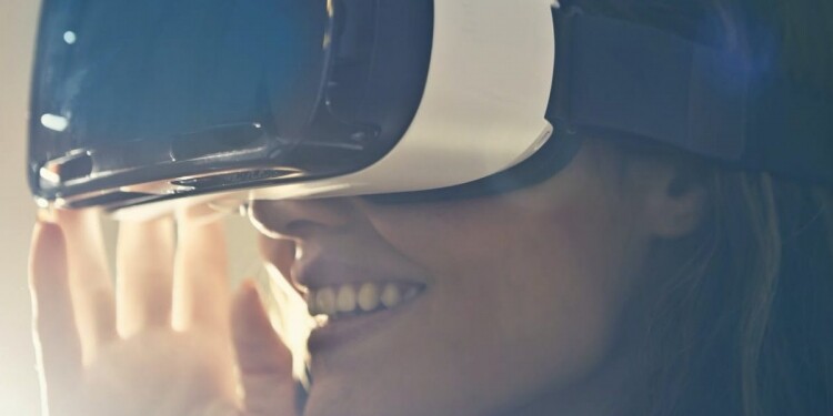 man wearing white virtual reality goggles