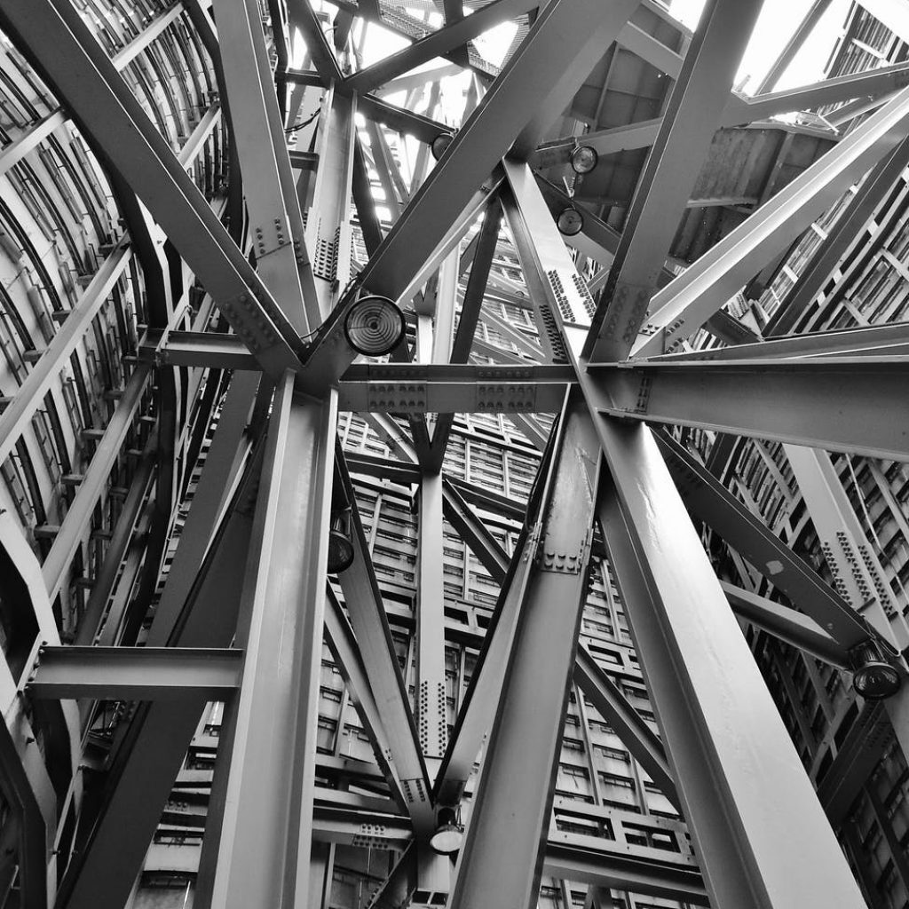grayscale photography of scafoldings