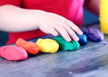 person making clay figures