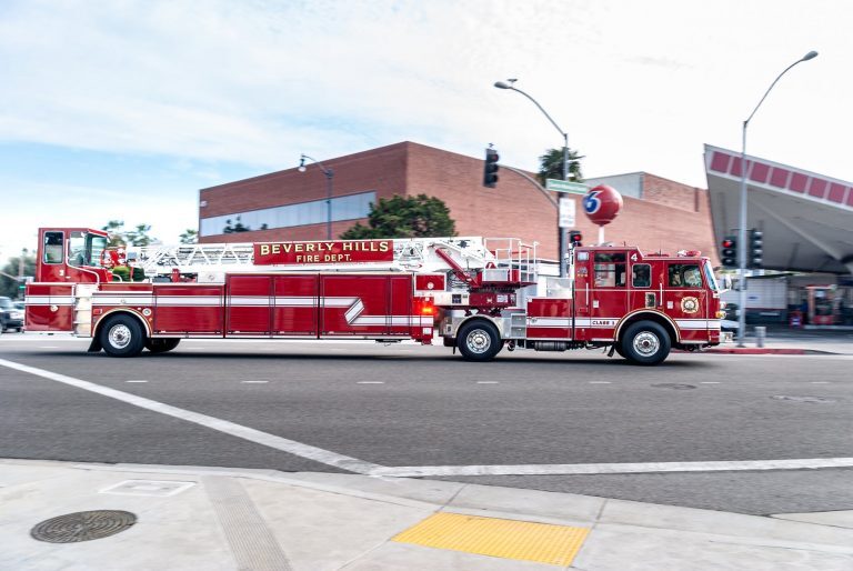 red and white fire truck on road - stock photo