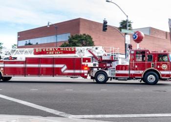 red and white fire truck on road - stock photo