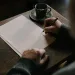 a man writing a letter