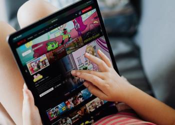 little girl holding a tablet