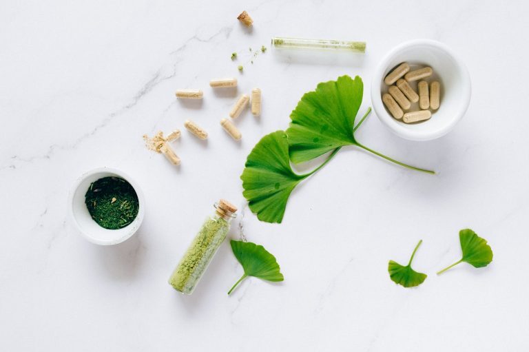 ginkgo leaves and glass containers with powder