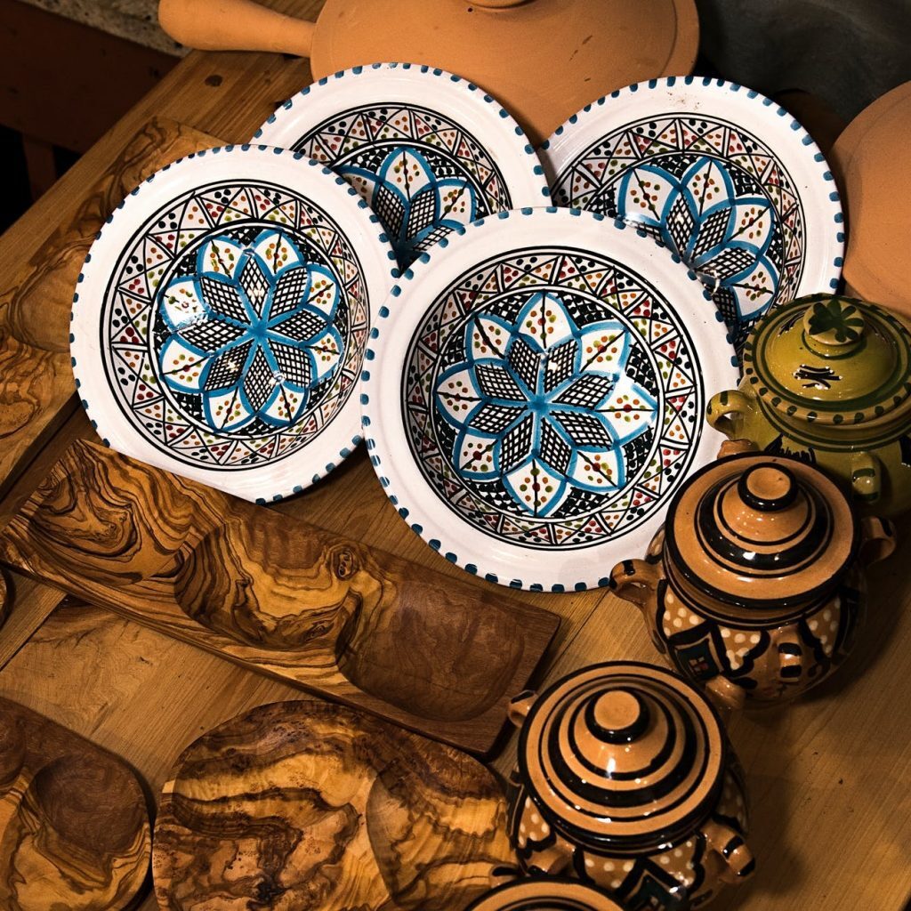 art photography of decorative plates and pots with lids