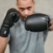 strong ethnic fighter showing punching technique during training