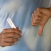 a person holding an antigen rapid test result
