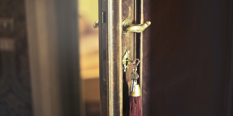 key with trinket in shabby door