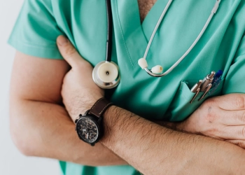 crop doctor with stethoscope in hospital