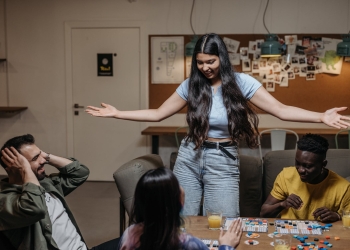 friends playing a board game together