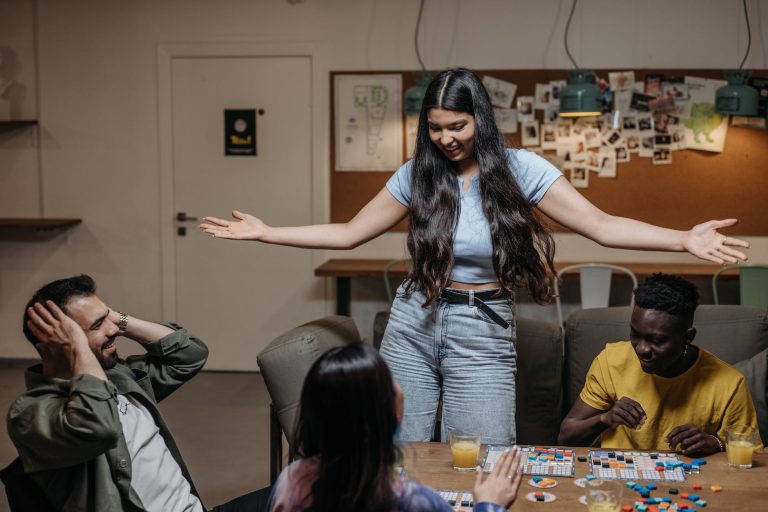 friends playing a board game together