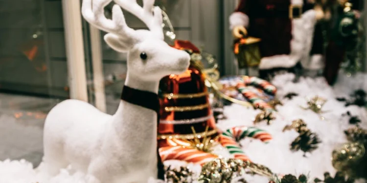shop showcase festive decorations with shiny baubles and santa figurine