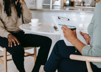 crop faceless multiethnic interviewer and job seeker going through interview