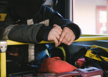 firefighter inside of a fire truck