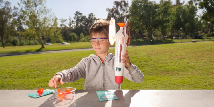 a boy playing a rocket